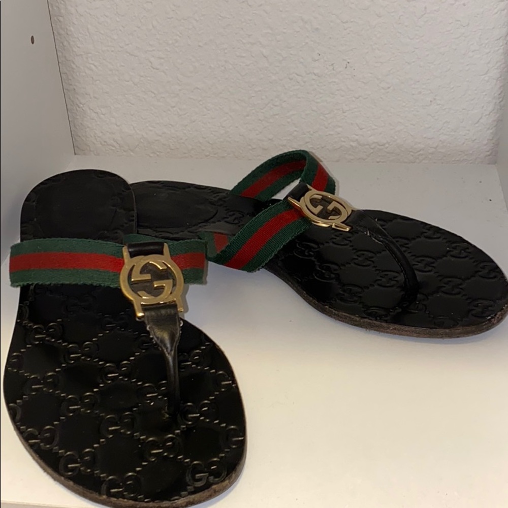 Gucci thong sandals , worn scuffed on bottom